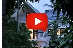 Kerala Colonial House Design with traditional sloping roof, verandah, and classic architectural elements