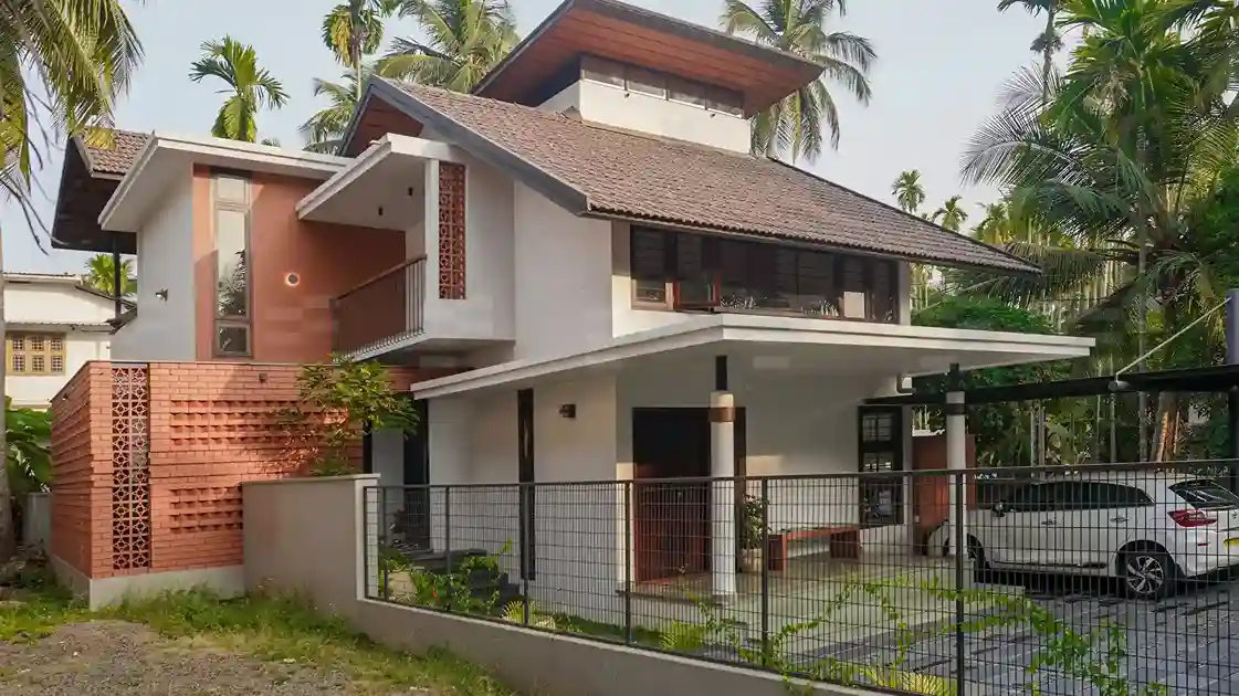 Exterior view of The Muneer Residence designed by top residential architects in Malappuram, featuring modern architecture and landscaped surroundings.