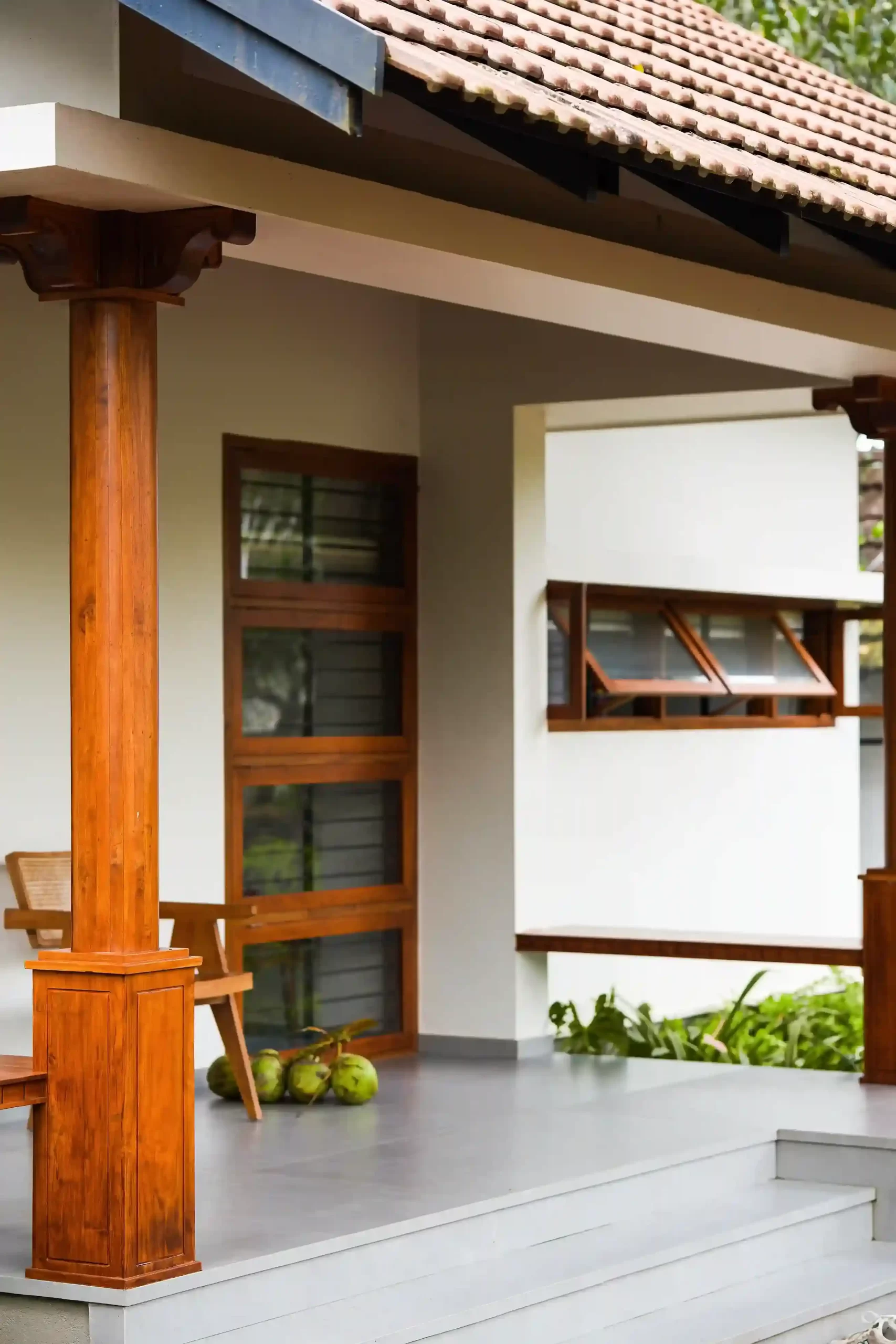 Traditional Kerala house sit-out design with wooden columns