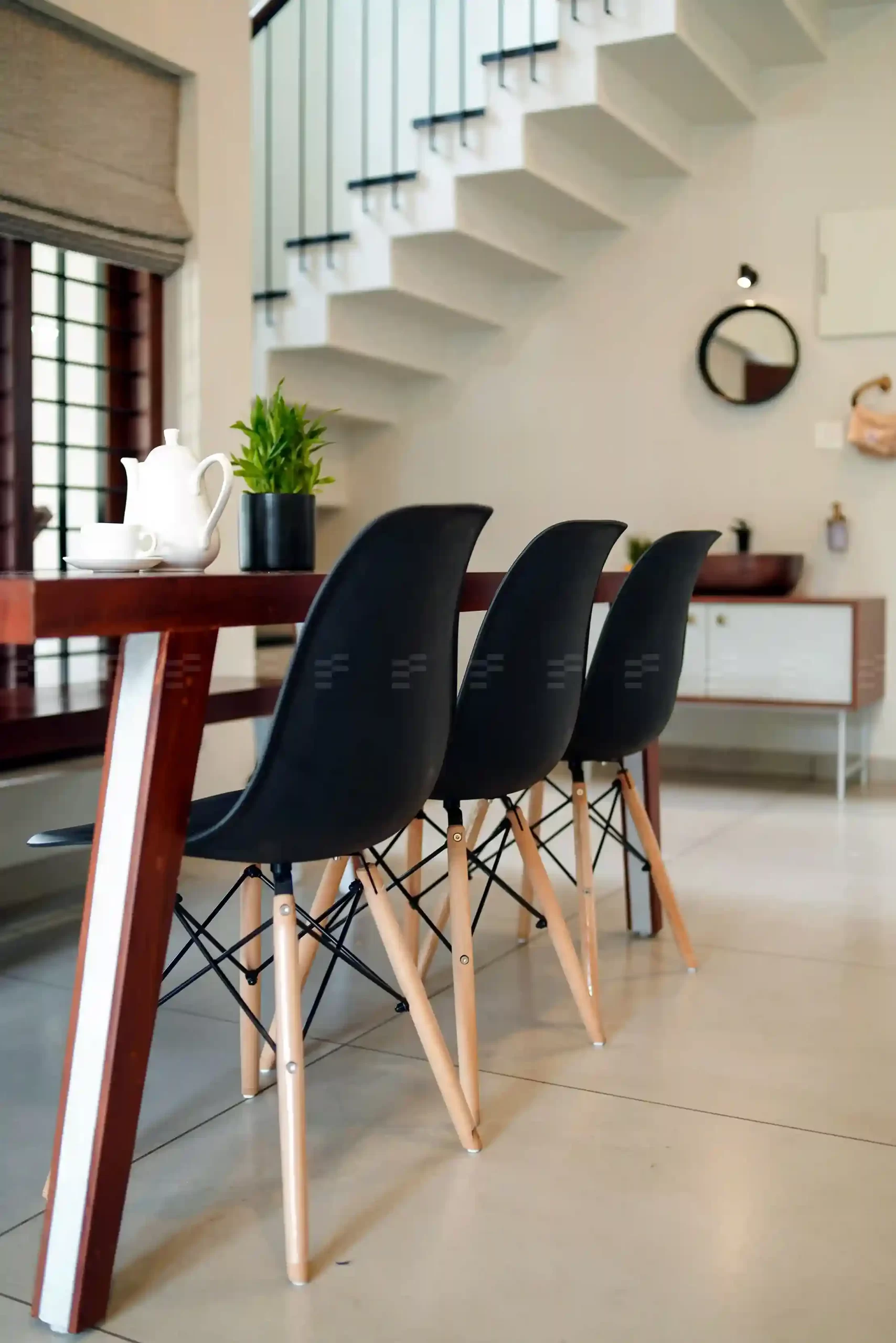 Dining area by top residential architects with open layout and airy, minimalist design.