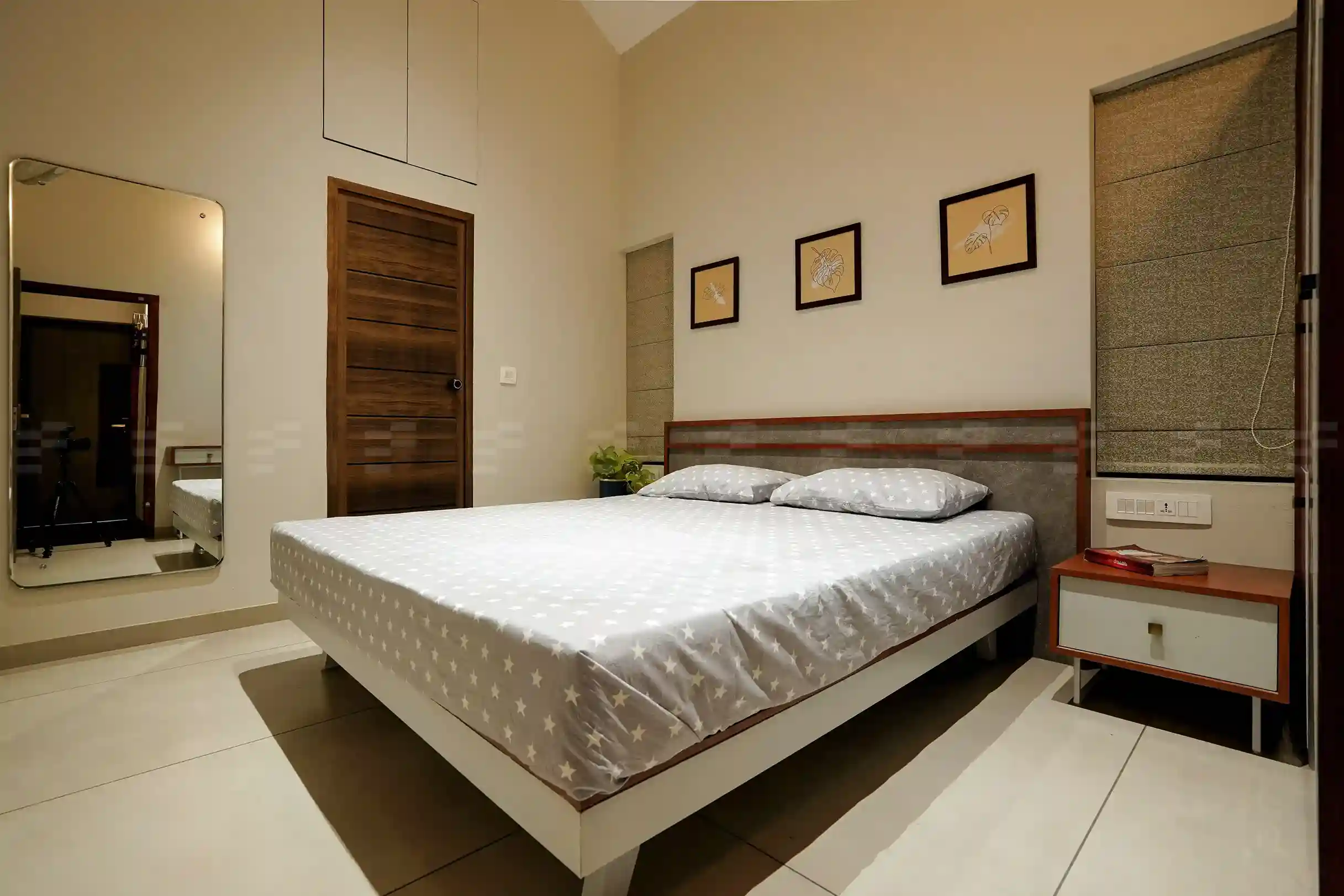 Top residential architects crafted this serene bedroom with soft tones and practical storage.