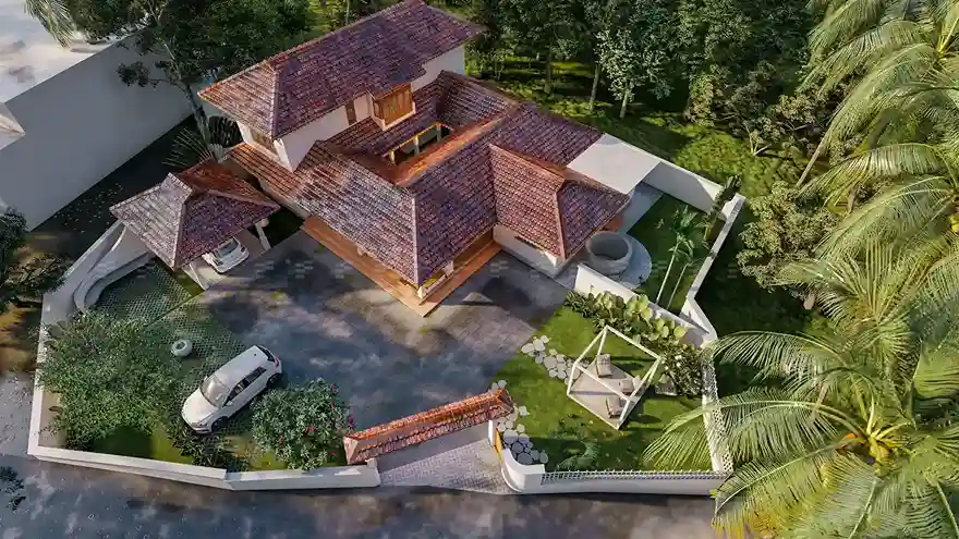 Traditional Kerala-style home with sloping roof, wooden pillars, and a serene courtyard designed by expert architects