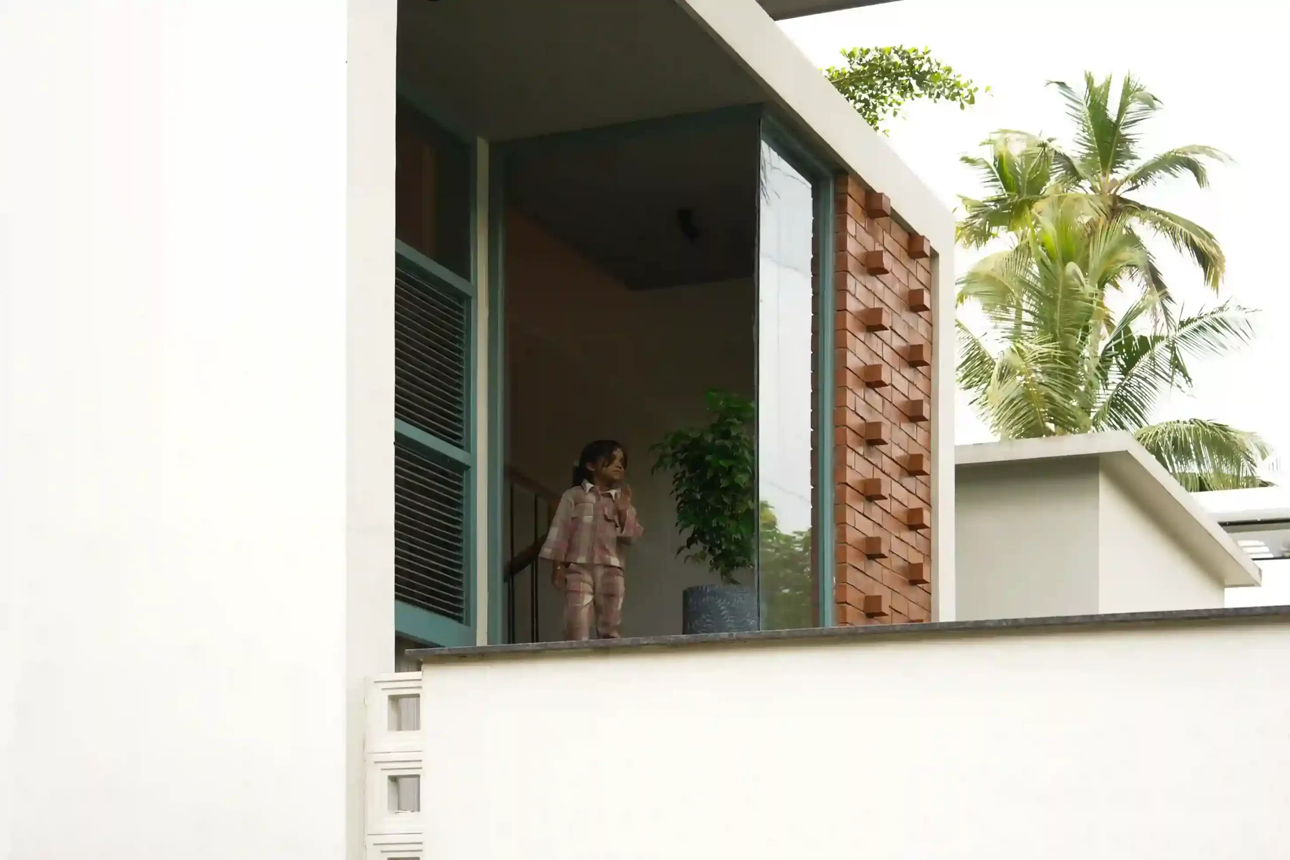 Contemporary house design Kerala showcasing balcony and windows