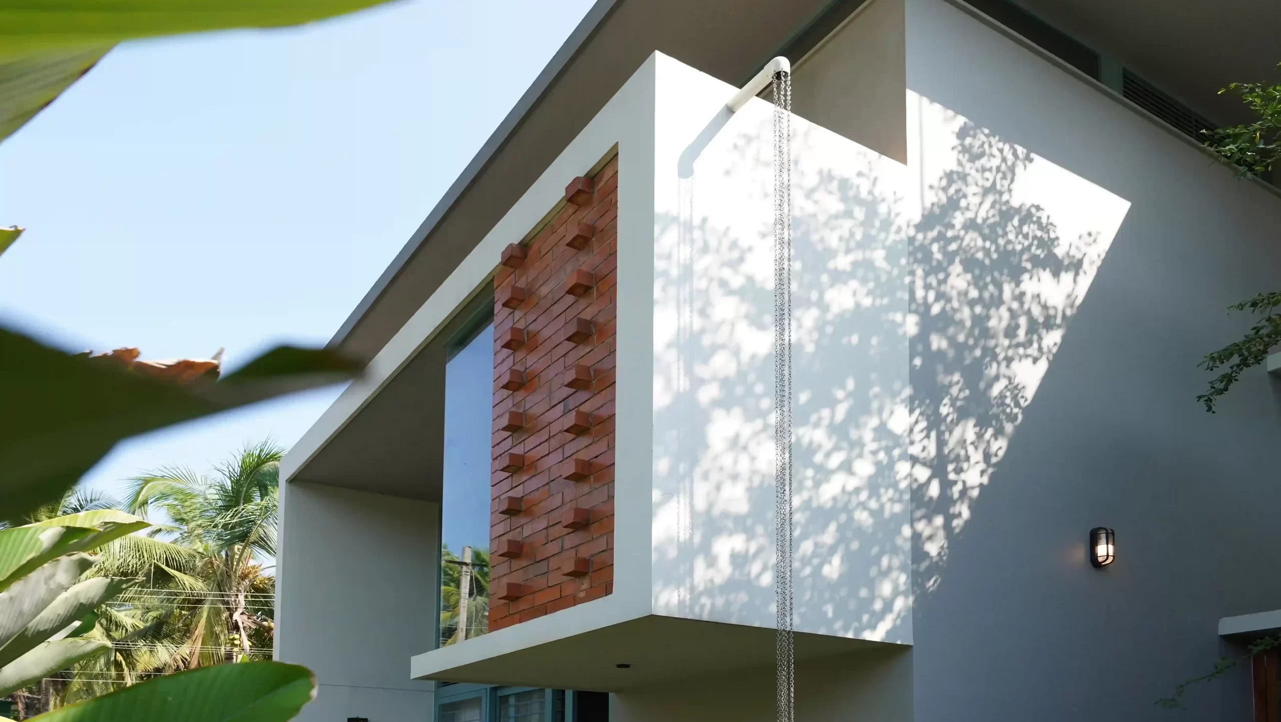 Experienced residential architects in Malappuram designing a stylish contemporary home with balanced proportions and natural elements – FORM Architects"