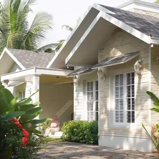 Colonial Style House in Kondotty – 5th Avenue residence featuring sloped roof design and elegant Kerala colonial architecture.